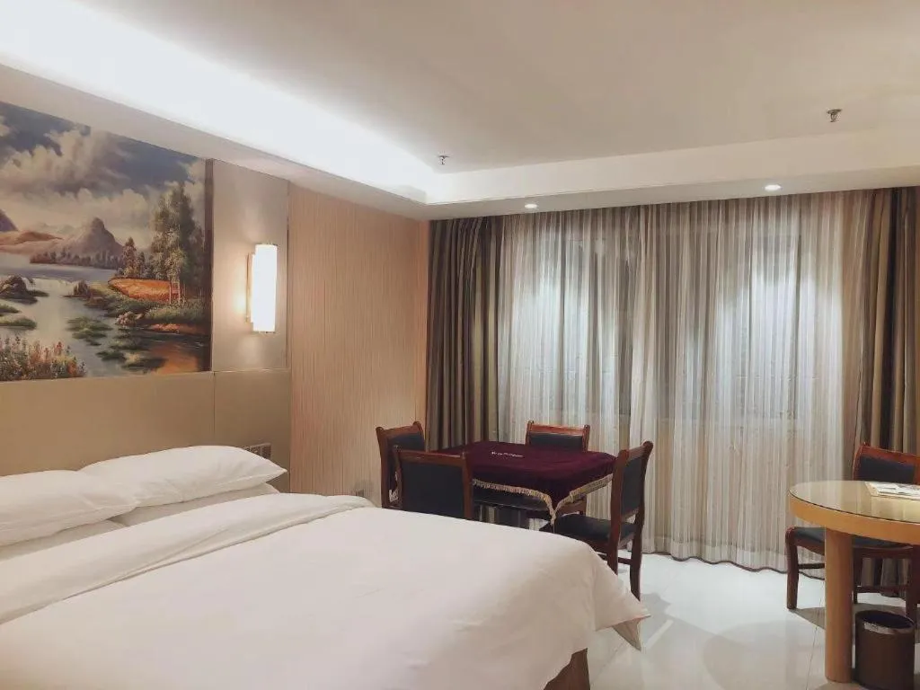 Bed in Vienna Hotel Shandong Qufu Sankong Landscape