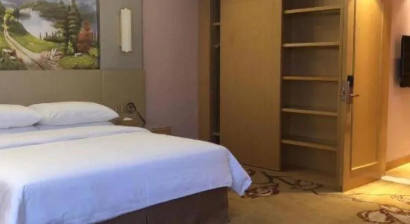 Bed in Vienna Hotel Shandong Qufu Sankong Landscape