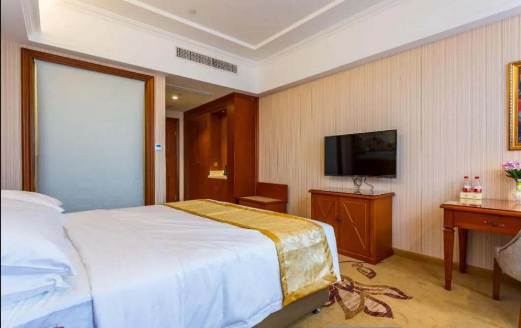 Bed in Vienna Hotel Shandong Qufu Sankong Landscape