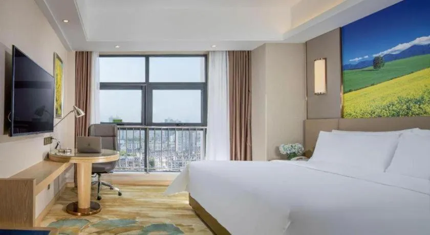 Bed in Vienna Hotel Shaanxi Hanzhong Central Square High-Speed Railway Station