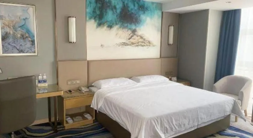 Bed in Vienna Hotel Shaanxi Hanzhong Central Square High-Speed Railway Station