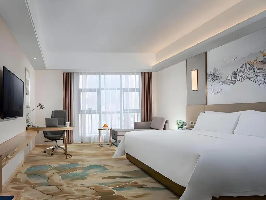 Bed in Vienna Hotel Shaanxi Hanzhong Central Square High-Speed Railway Station