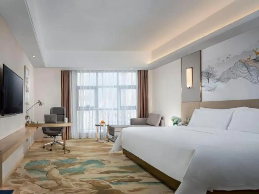 Bed in Vienna Hotel Shaanxi Hanzhong Central Square High-Speed Railway Station