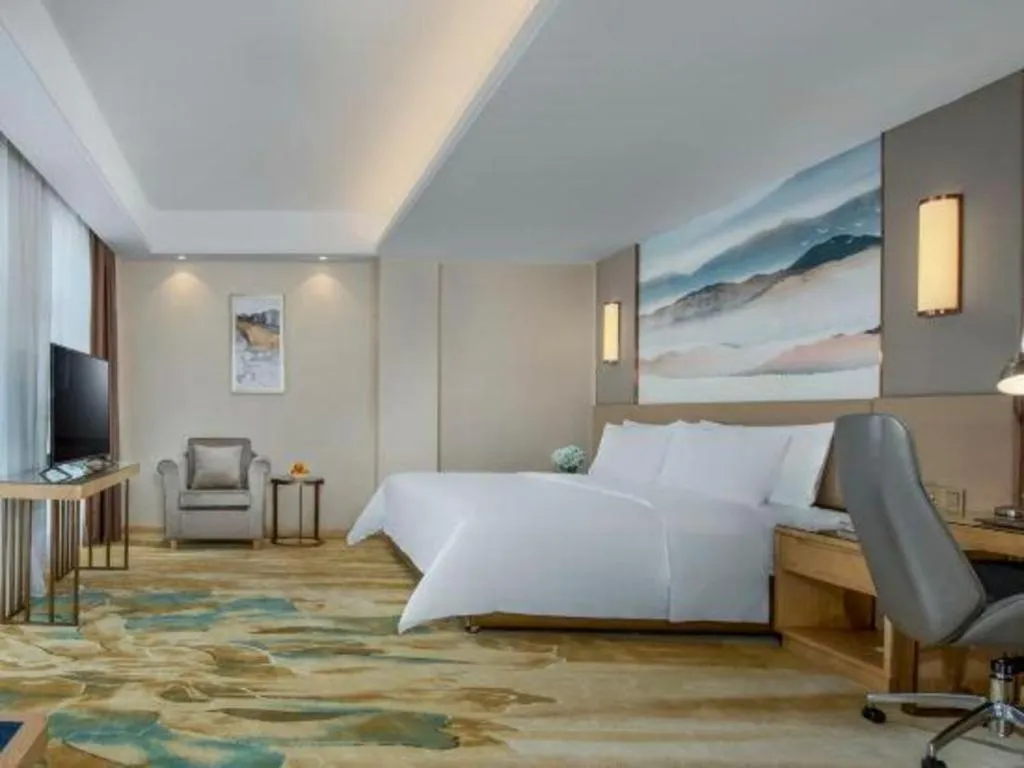Bed in Vienna Hotel Shaanxi Hanzhong Central Square High-Speed Railway Station