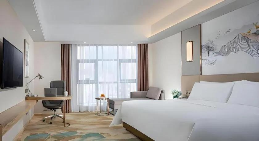 Bed in Vienna Hotel Shaanxi Hanzhong Central Square High-Speed Railway Station