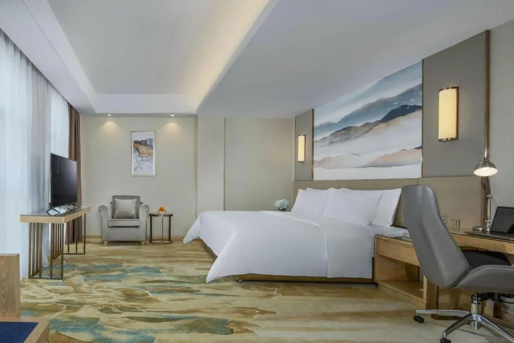 Bed in Vienna Hotel Shaanxi Hanzhong Central Square High-Speed Railway Station