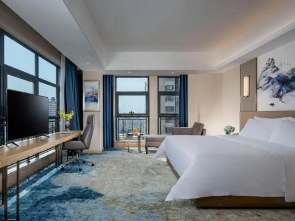 Bed in Vienna Hotel Shaanxi Hanzhong Central Square High-Speed Railway Station