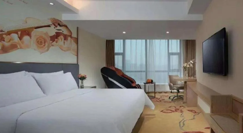 Bed in Vienna Hotel Shaanxi Hanzhong Central Square High-Speed Railway Station