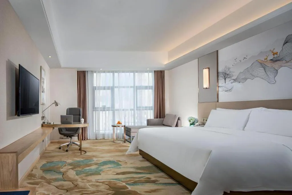 Bed in Vienna Hotel Shaanxi Hanzhong Central Square High-Speed Railway Station
