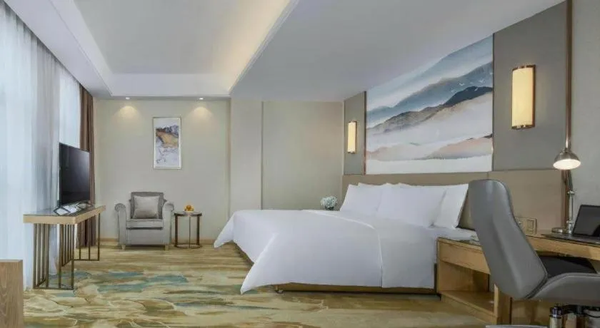 Bed in Vienna Hotel Shaanxi Hanzhong Central Square High-Speed Railway Station