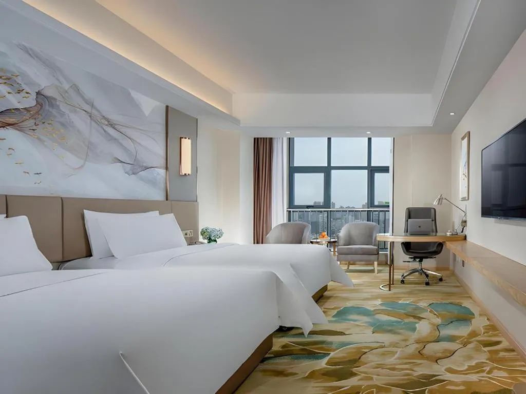 Bed in Vienna Hotel Shaanxi Hanzhong Central Square High-Speed Railway Station