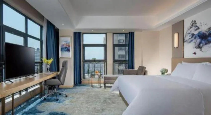 Bed in Vienna Hotel Shaanxi Hanzhong Central Square High-Speed Railway Station