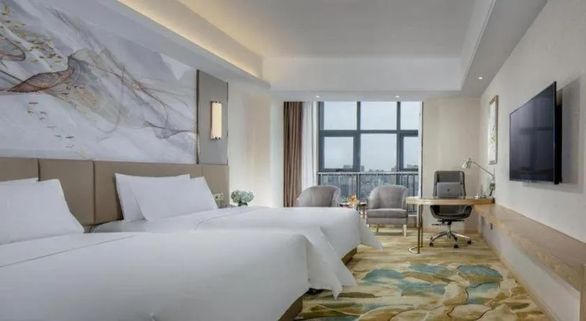 Bed in Vienna Hotel Shaanxi Hanzhong Central Square High-Speed Railway Station