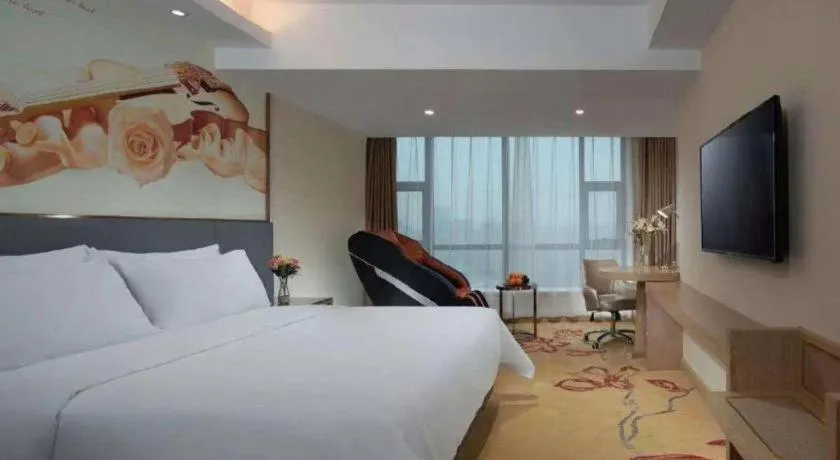 Bed in Vienna Hotel Shaanxi Hanzhong Central Square High-Speed Railway Station