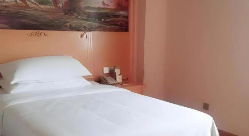 Bed in Vienna Hotel Shaanxi Ankang Jiangnan