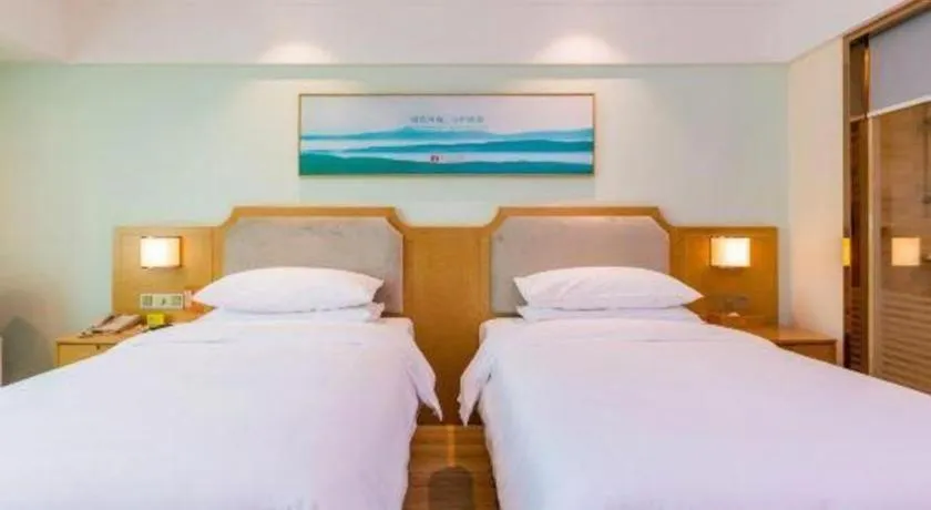 Bed in Vienna Hotel Guangdong Foshan Shunde Longjiang Material City