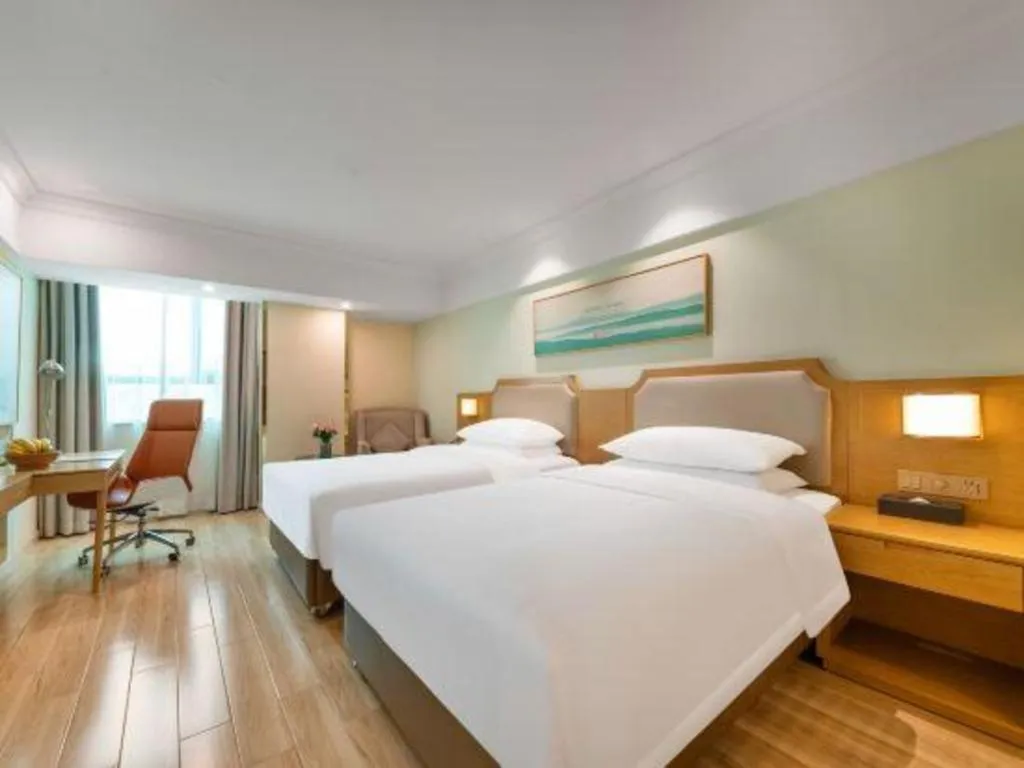 Bed in Vienna Hotel Guangdong Foshan Shunde Longjiang Material City