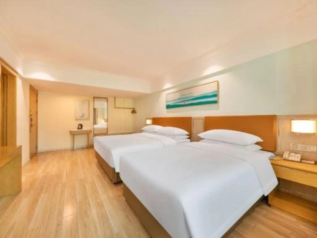 Bed in Vienna Hotel Guangdong Foshan Shunde Longjiang Material City