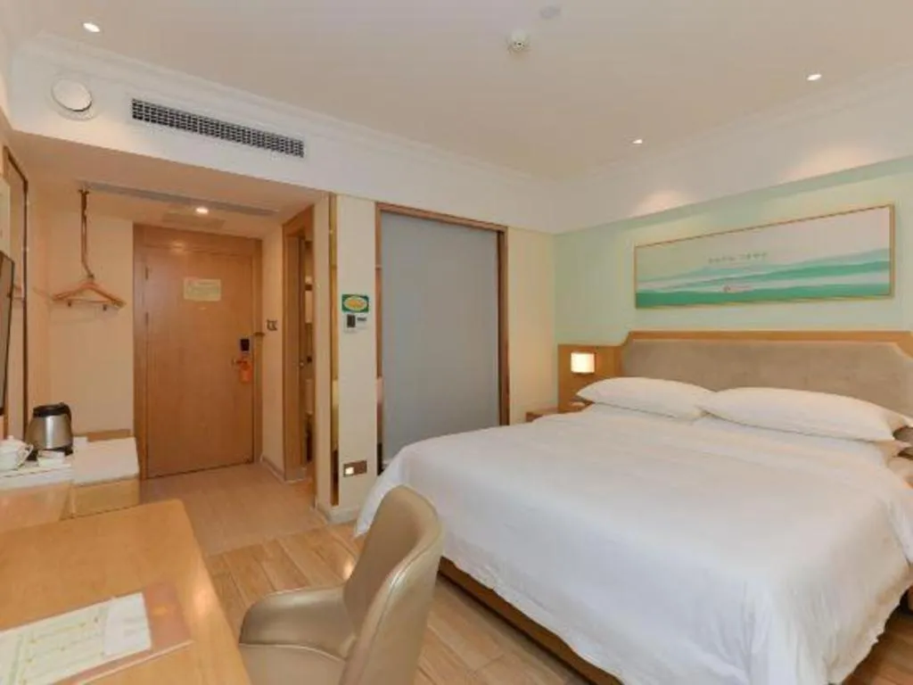 Bed in Vienna Hotel Guangdong Foshan Shunde Longjiang Material City