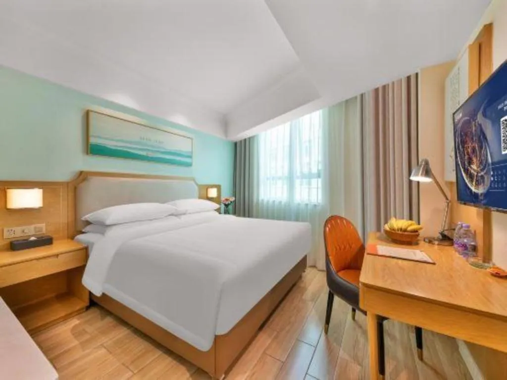 Bed in Vienna Hotel Guangdong Foshan Shunde Longjiang Material City