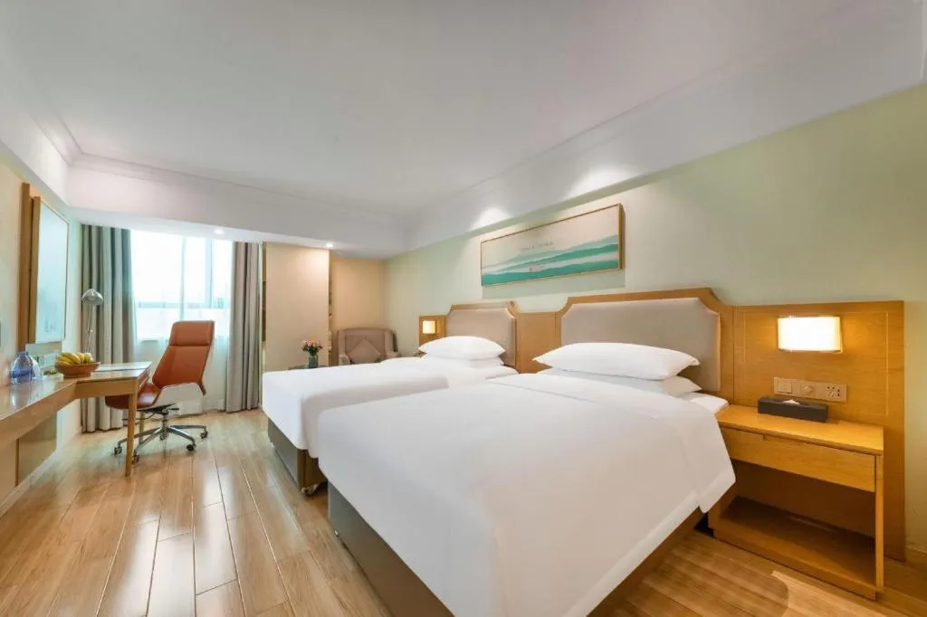 Bed in Vienna Hotel Guangdong Foshan Shunde Longjiang Material City