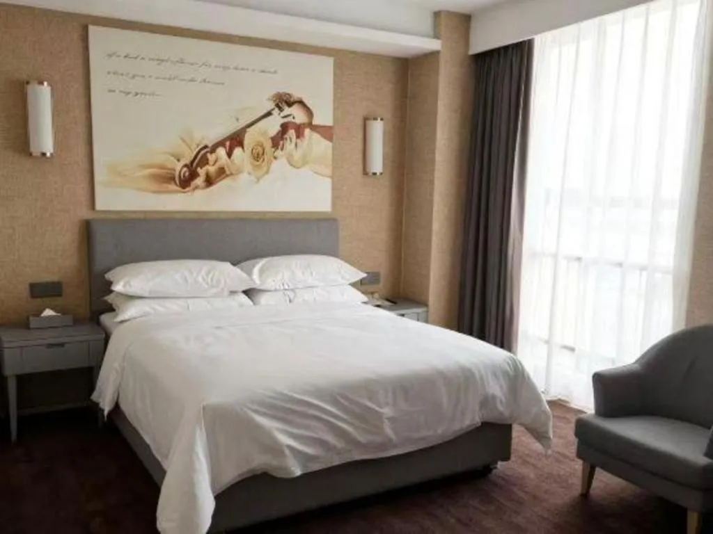 Bed in Vienna Hotel Guangdong Foshan West Station Airport Luocun