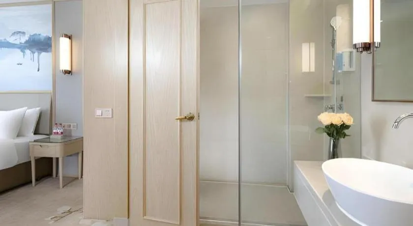 Bed in Vienna Hotel Yunnan Dali Erhai Lake