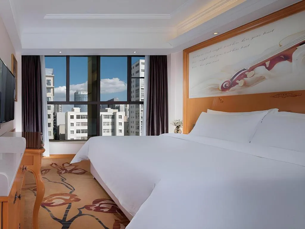 Bed in Vienna Hotel Kunming Beijing Road Chuanxin Gulou Metro Station