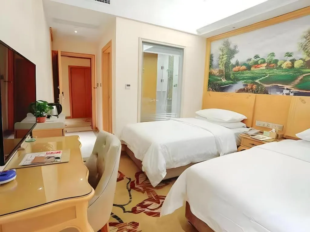 Bed in Vienna Hotel Kunming Beijing Road Chuanxin Gulou Metro Station