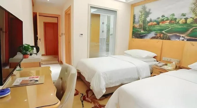 Bed in Vienna Hotel Kunming Beijing Road Chuanxin Gulou Metro Station