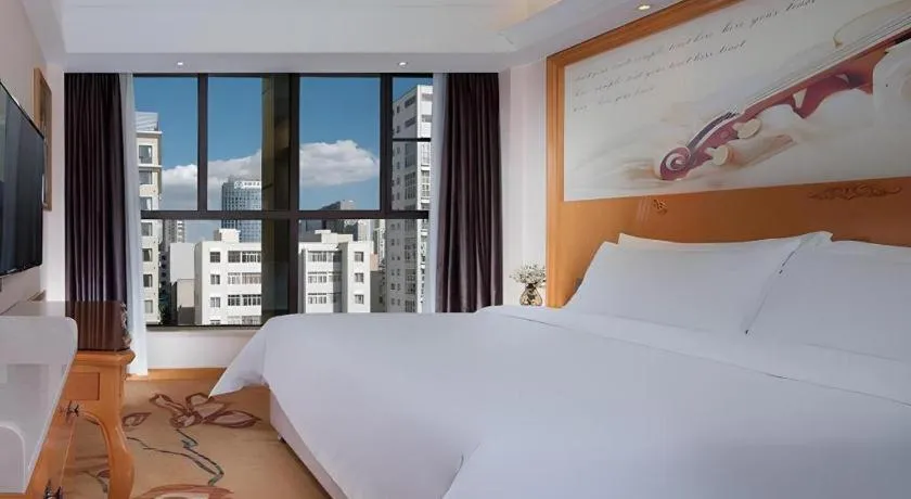 Bed in Vienna Hotel Kunming Beijing Road Chuanxin Gulou Metro Station