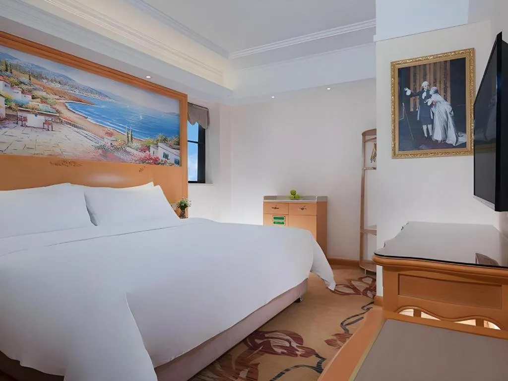 Bed in Vienna Hotel Kunming Beijing Road Chuanxin Gulou Metro Station