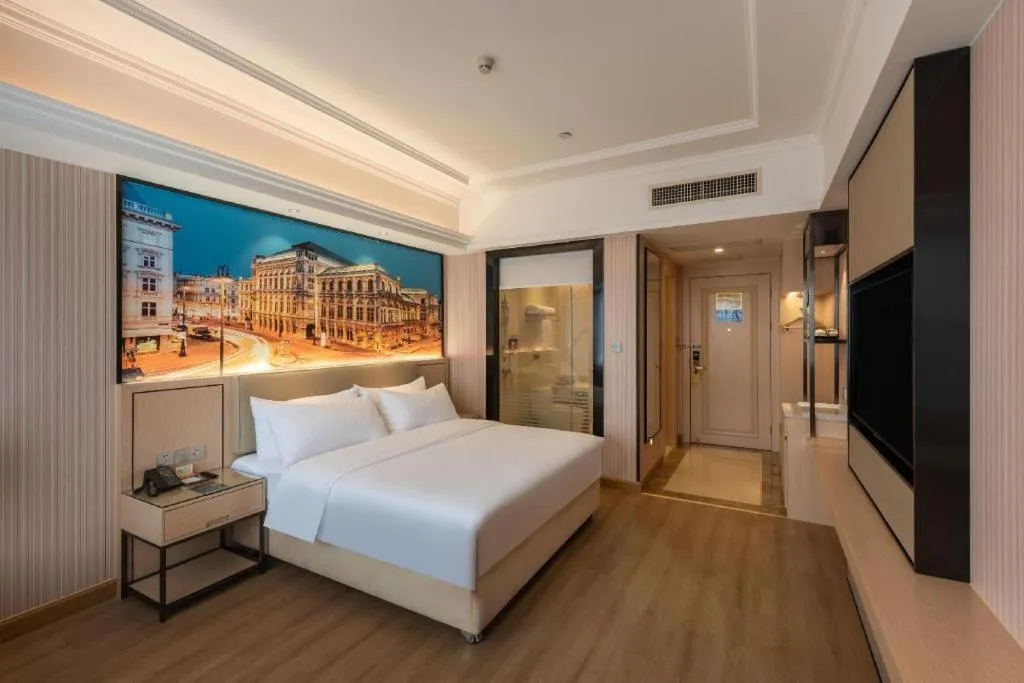 Bed in Vienna Hotel Ganzhou Economic Development Zone 1st Hospital West High-Speed Railway Station