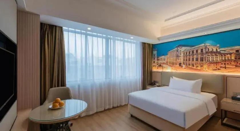 Bed in Vienna Hotel Ganzhou Economic Development Zone 1st Hospital West High-Speed Railway Station Bed in Vienna Hotel Ganzhou Economic Development Zone 1st Hospital West High-Speed Railway Station