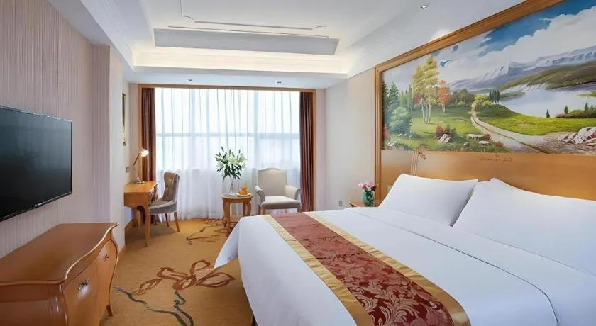 Bed in Vienna Hotel Ganzhou Economic Development Zone 1st Hospital West High-Speed Railway Station