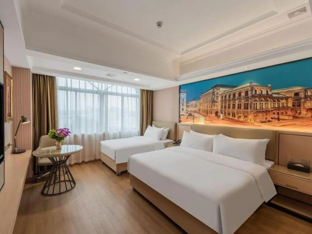 Bed in Vienna Hotel Ganzhou Economic Development Zone 1st Hospital West High-Speed Railway Station