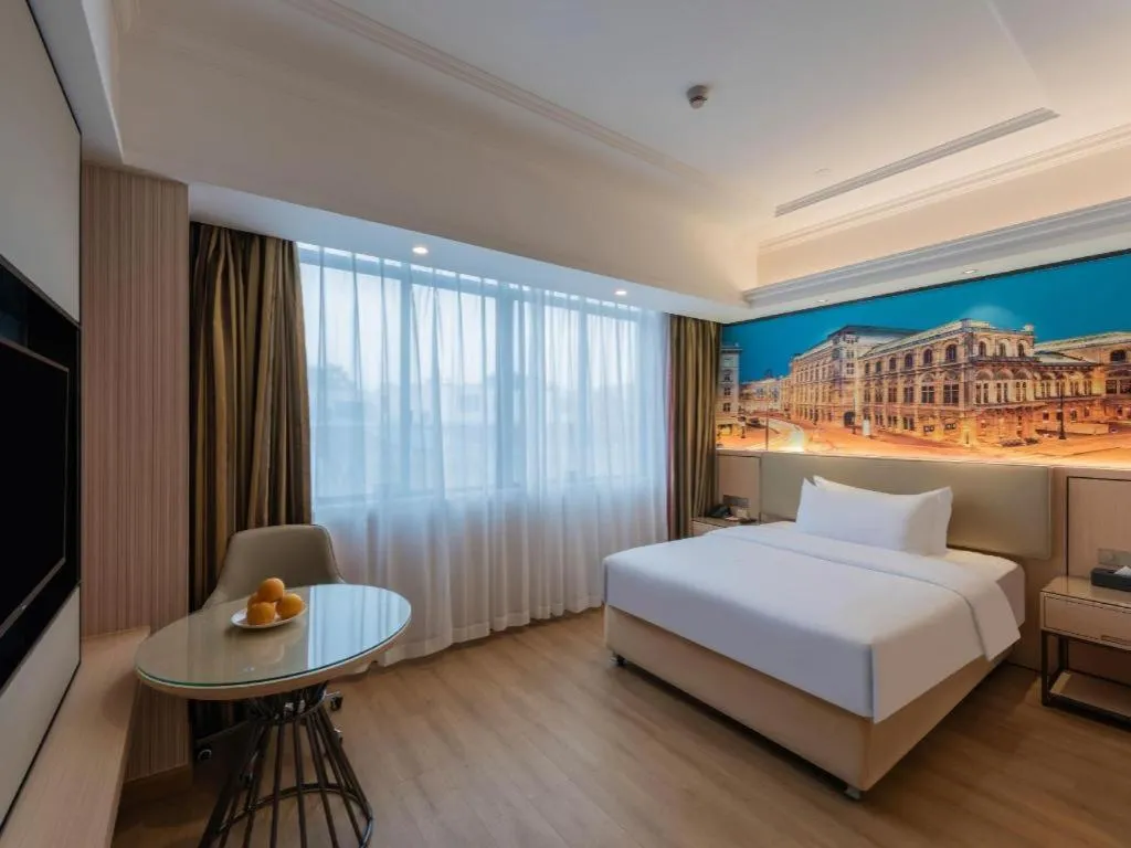 Bed in Vienna Hotel Ganzhou Economic Development Zone 1st Hospital West High-Speed Railway Station