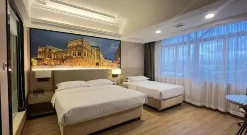 Bed in Vienna Hotel Ganzhou Economic Development Zone 1st Hospital West High-Speed Railway Station Bed in Vienna Hotel Ganzhou Economic Development Zone 1st Hospital West High-Speed Railway Station