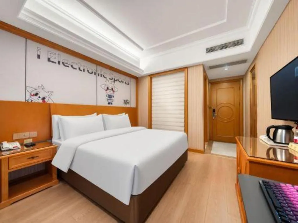 Bed in Vienna Hotel Shanghai Hongqiao National Exhibition Cente Sijing Metro Station