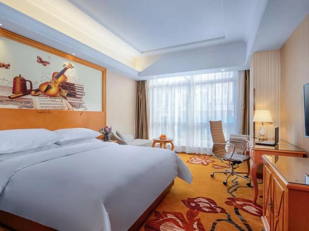 Bed in Vienna Hotel Shanghai Hongqiao National Exhibition Cente Sijing Metro Station