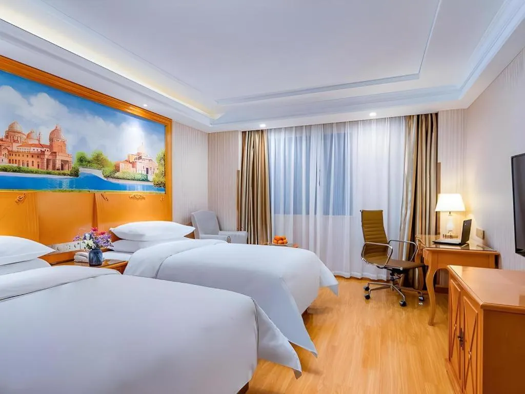 Bed in Vienna Hotel Shanghai Hongqiao National Exhibition Cente Sijing Metro Station
