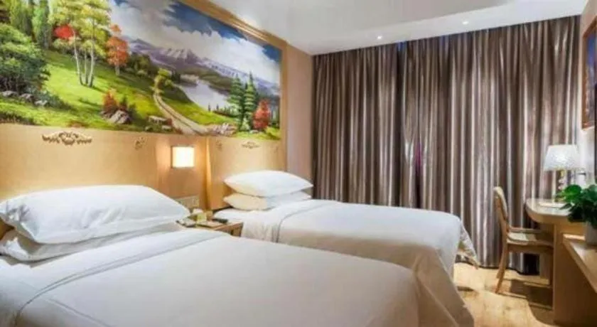 Bed in Vienna Hotel Shanghai Hongqiao National Exhibition Cente Sijing Metro Station