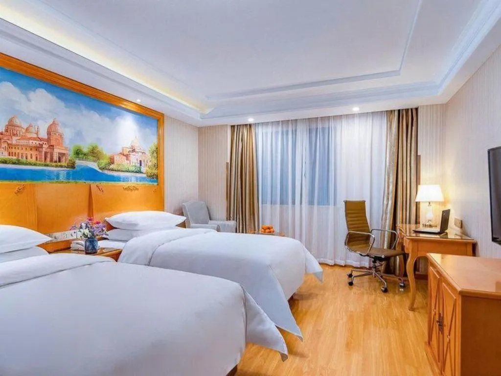 Bed in Vienna Hotel Shanghai Hongqiao National Exhibition Cente Sijing Metro Station