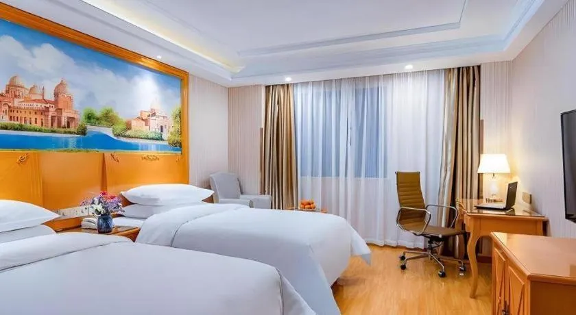 Bed in Vienna Hotel Shanghai Hongqiao National Exhibition Cente Sijing Metro Station