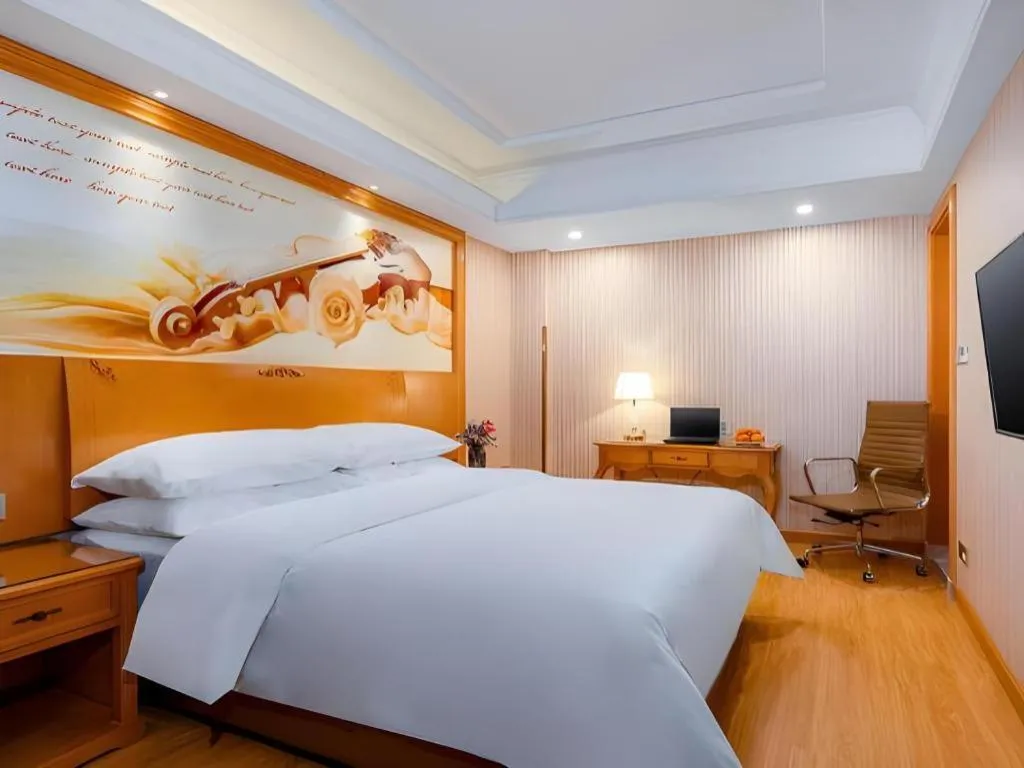 Bed in Vienna Hotel Shanghai Hongqiao National Exhibition Cente Sijing Metro Station