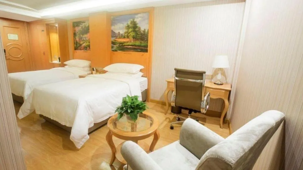 Bed in Vienna Hotel Shanghai Hongqiao National Exhibition Cente Sijing Metro Station