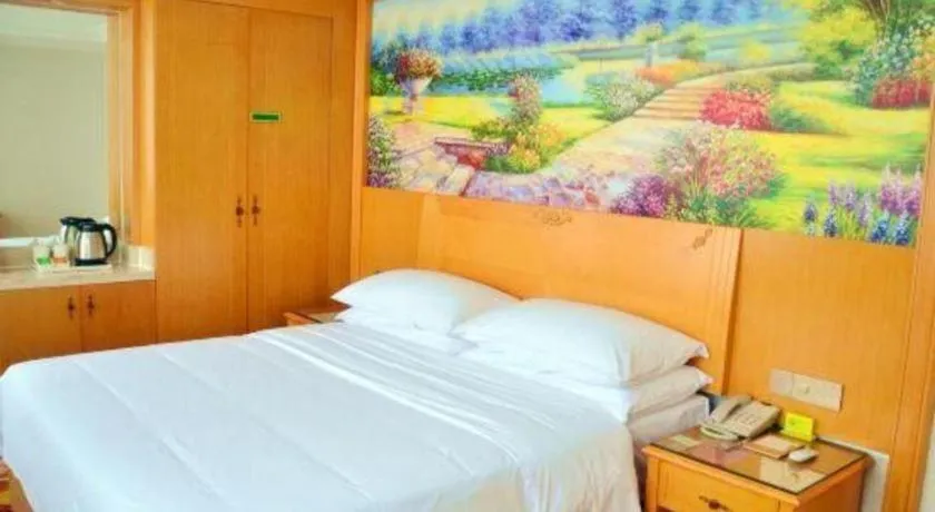 Bed in Vienna Hotel Guangdong Zhaoqing Sihui Center Jade Expo Market