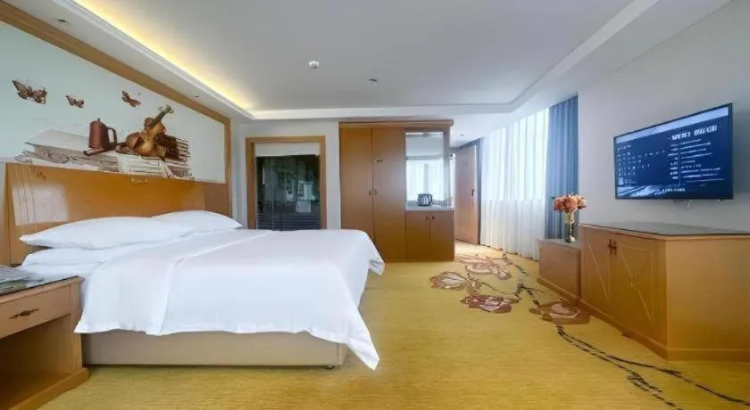 Bed in Vienna Hotel Guangdong Zhaoqing Sihui Center Jade Expo Market