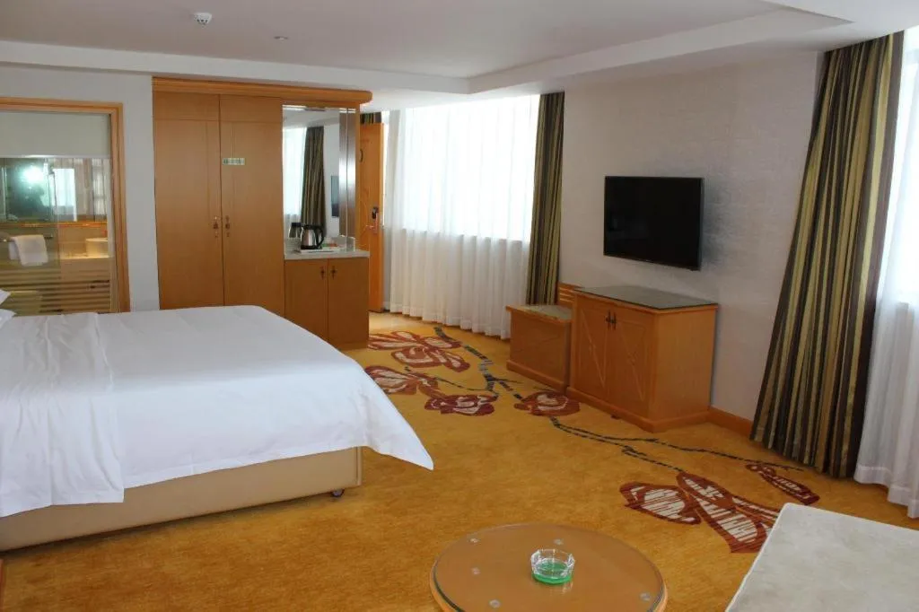 Bed in Vienna Hotel Guangdong Zhaoqing Sihui Center Jade Expo Market