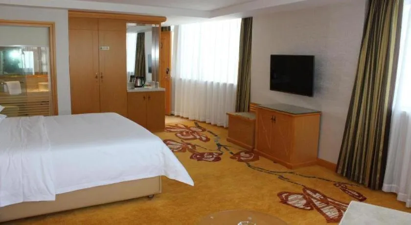 Bed in Vienna Hotel Guangdong Zhaoqing Sihui Center Jade Expo Market